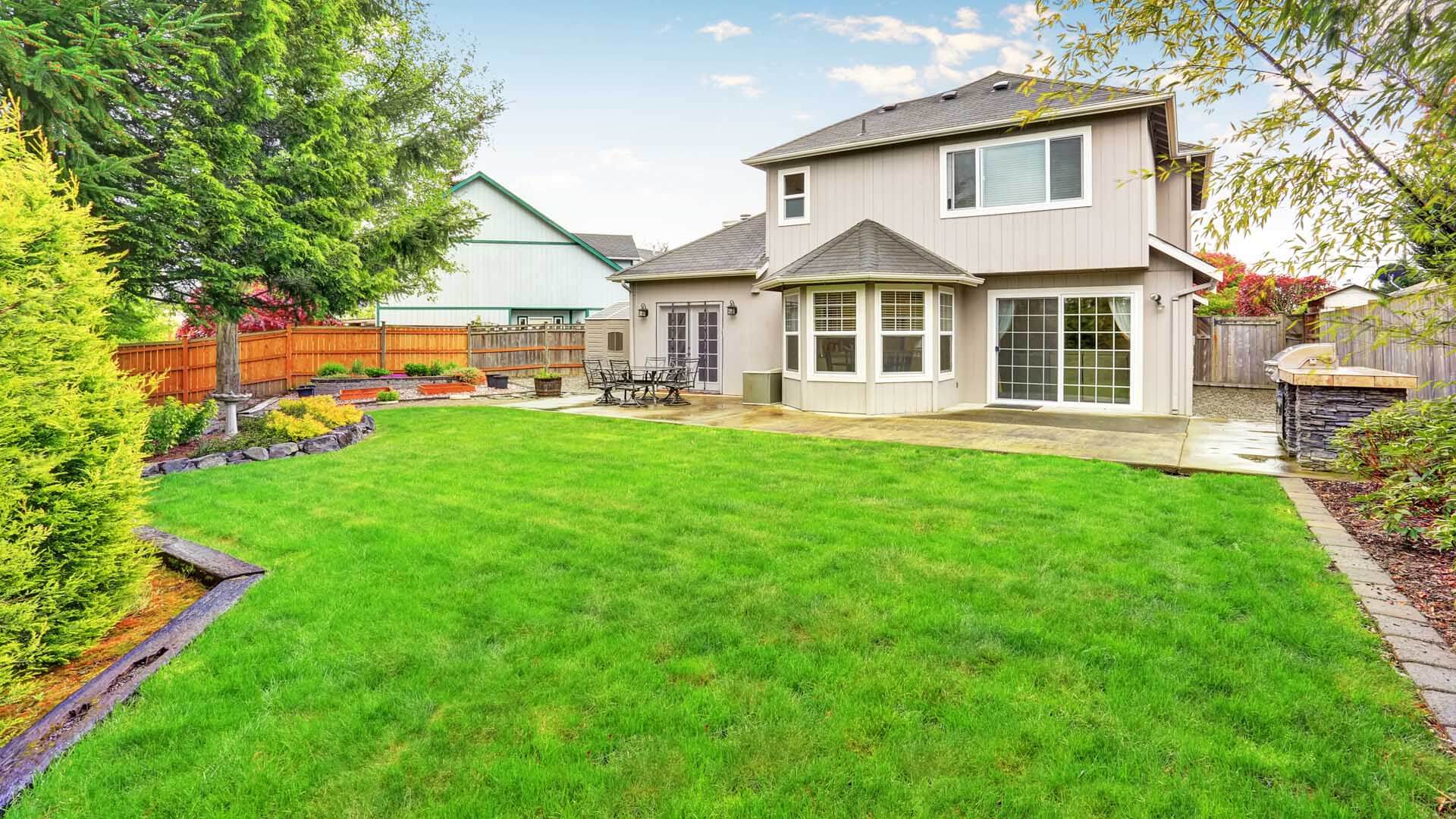 Backyard receiving ongoing lawn mowing and maintenance.